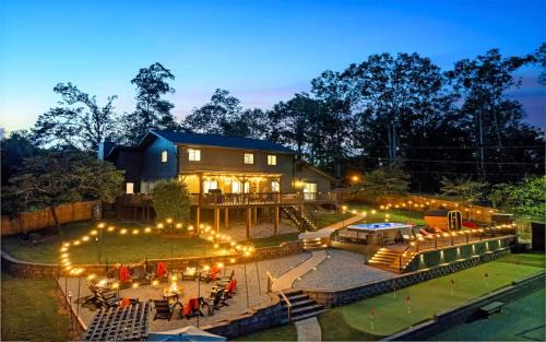 Conestee House | Breathtaking Private Lakefront House with Swim Spa, Pickleball Court, Game room & Theater, Sauna, Dock, Firepit and Golf Putting Green