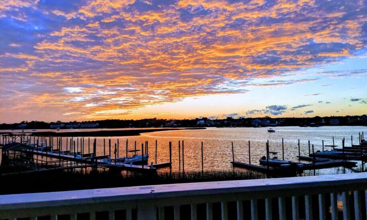 North Carolina Coast Villa | Canal-Front Townhome w/Private Boat Slip, Pool & Beach Access