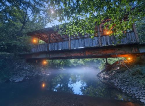 Stanton House | Covered Bridge Tiny Home Bus on the water in RRG