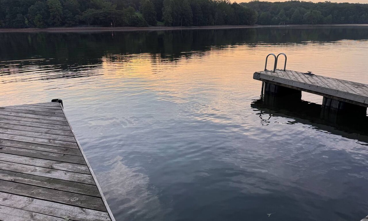 Union Hall Cabin | Plenty of Water on the main channel. Perched on a bluff with breathtaking sunrise views over the lake, this remodeled 2BR/1BA log cabin offers memory-foam beds, well-stocked granite kitchen (farm-fresh eggs!), covered deck, stone fire pit, huge dock.