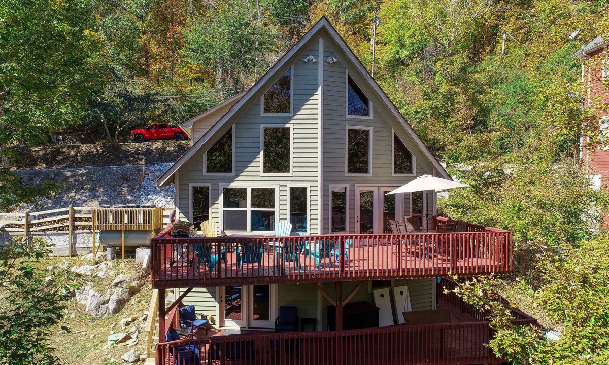 Flat Hollow Marina Cabin | Rustic Lakefront Cabin with private double-deck dock, slide, hot tub, more!