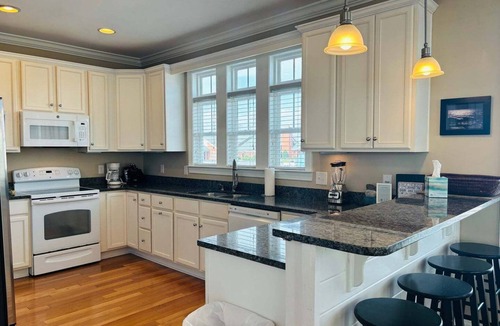 Holden Beach House | 1 Fine Day, a 4BR oceanfront retreat in Holden Beach, sleeps 10 with stunning views.