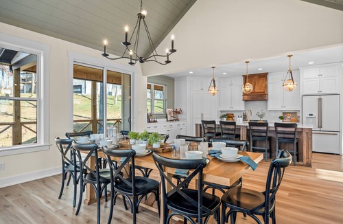 Clarkson House | Brand new 6BR luxury retreat in the Paradise Grove golf cart community near Nolin Lake. Enjoy a designer interior, hot tub, fire pit, private backyard, and fully equipped kitchen. Perfect for groups with ping pong, shuffleboard, and space to relax