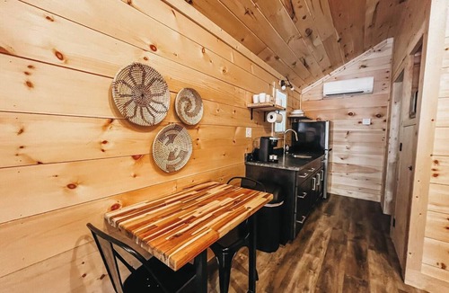 Hartwell RV Rental | Cabin #6: Studio style layout with kitchenette and a large gravel parking pad beside the cabin for easy boat or trailer storage.