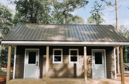 Hartwell RV Rental | Cabin #9: One king-size bed, a kitchenette, and a large gravel parking pad beside the cabin for easy boat or trailer storage.