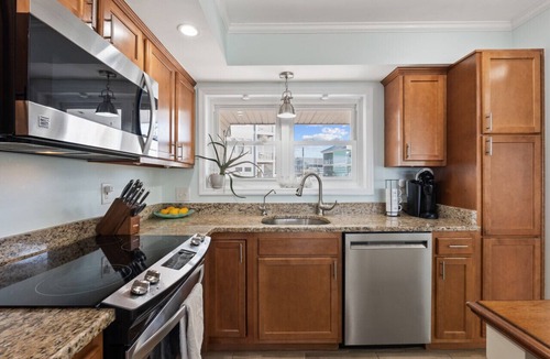 North Carolina Coast Villa | Canal-Front Townhome w/Private Boat Slip, Pool & Beach Access