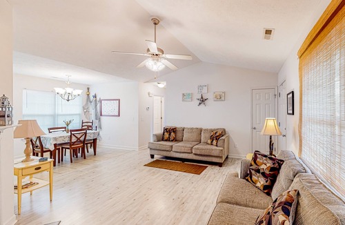 Southport House | Charming dog-friendly home with pool access, screened patio, cozy deck & W/D