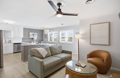 Wrightsville Beach Apartment | Coastal 4BR/4BA coastal duplex featuring king and queen ensuite bedrooms, a fully stocked kitchen, fenced pet-friendly yard, outdoor shower, beach gear, Smart TVs, WiFi, and parking for up to 6+ vehicles.