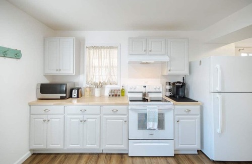 North Carolina Coast Apartment | Coastal Cozy and Close to Beach with Turf Yard!