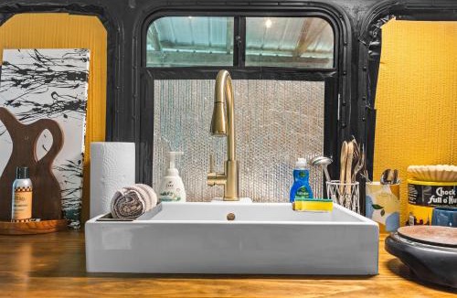 Stanton House | Covered Bridge Tiny Home Bus on the water in RRG