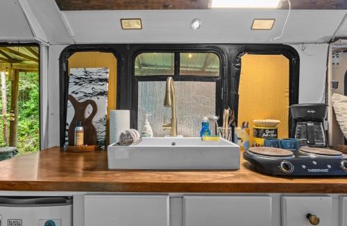 Stanton House | Covered Bridge Tiny Home Bus on the water in RRG