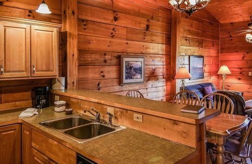 Spencer Cabin | Cozy, knotted pine lodge and cabin with fire pits, fireplaces, PET friendly