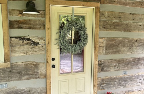 Cookeville Cabin | Cozy Love Shack: Rustic Log Cabin, Outdoor Living Room/Treehouse, & Fireplaces