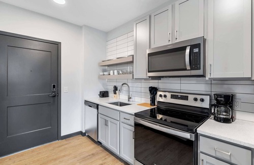 Lockerbie Square Apartment | CozySuites Mass with lounge and roof deck #30