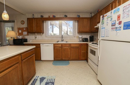 Southern Shores House | Cuckoo's Nest - 4 Bed, 2 Bath dog friendly home with pool, hot tub and tiki bar!