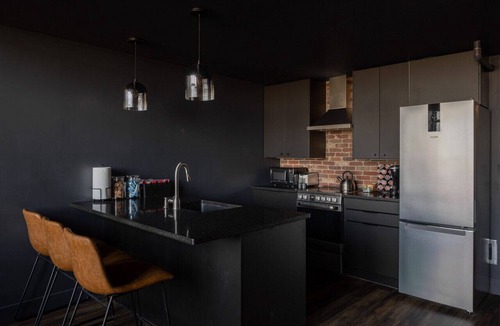 West Main Historic District Condo | DerbyCity Plush Loft. Gather in Style by Hollyhock