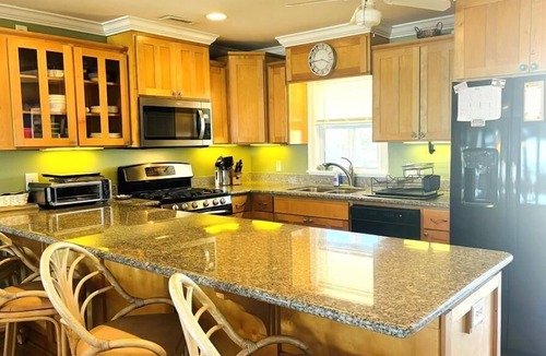 Holden Beach House | Discover Clamelot in Holden Beach: a 4-bedroom oceanfront haven for up to 8 guests!