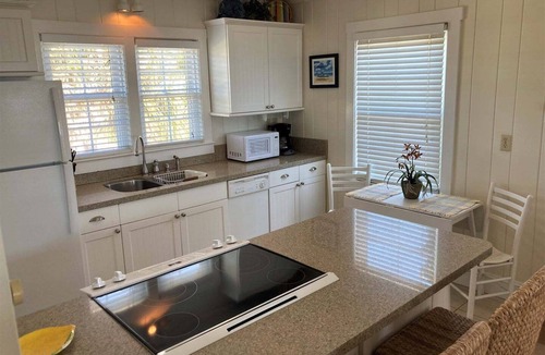 Holden Beach House | Experience bliss at Coast 'N Along, a spacious 3-bedroom retreat in Holden Beach.