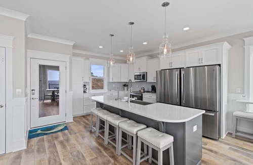 Oak Island House | Experience luxury at '7 Day Weekend,' an oceanfront 7-bedroom retreat in Oak Island.