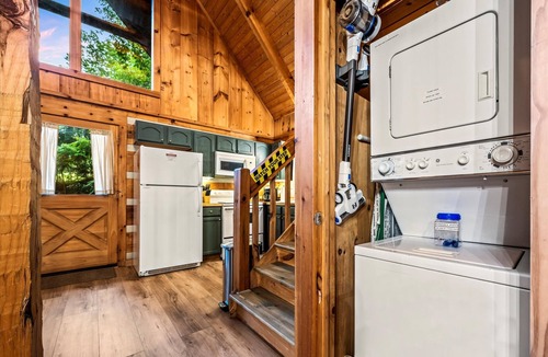Sevierville Cabin | Gingerbread log cabin! Hot tub/projector/fire pit/king bed/yoga chair, ROMANTIC!