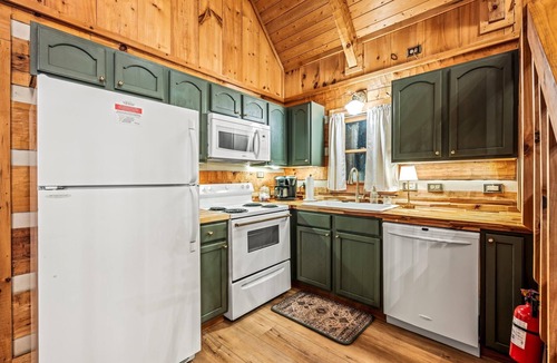 Sevierville Cabin | Gingerbread log cabin! Hot tub/projector/fire pit/king bed/yoga chair, ROMANTIC!