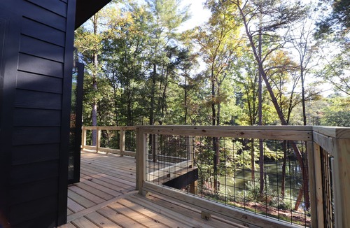 Roaring River Cabin | Gotham City Cabins! Secluded “Custom Modern Cabin” overlooking Private Pond.