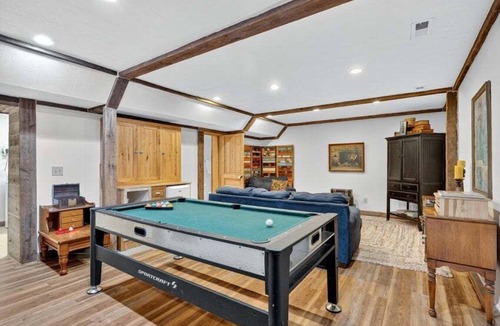 Guntersville Cabin | Historic lakefront log cabin on Lake Guntersville, restored from two pre-Civil War cabins. Sleeps 20 with 4BR/5BA, loft bunks, designer finishes, modern comforts, and steps to swimming, fishing & boating.
