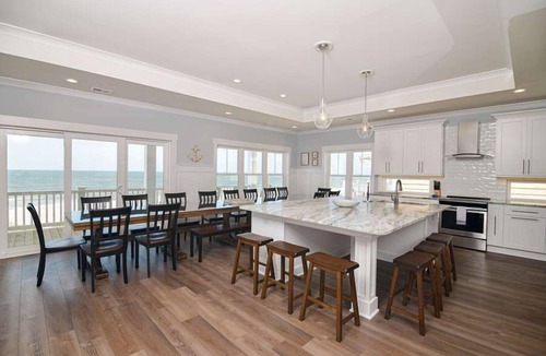 Holden Beach House | Hobbs Realty - Glad you're "Knot At Work" in this oceanfront home with a heatable pool and elevator