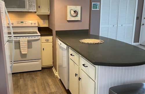 Garden City Cottage | Jacana Cabana: golf cart included with no pet fee!