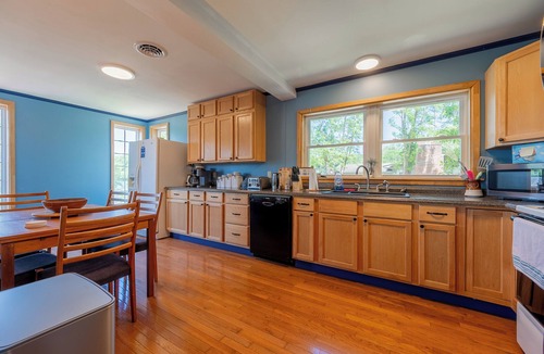 Ingles House | Lakefront Radford retreat with private dock, deck dining, Samsung Smart TV, and cozy queen bedrooms.