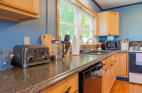 Ingles House | Lakefront Radford retreat with private dock, deck dining, Samsung Smart TV, and cozy queen bedrooms.