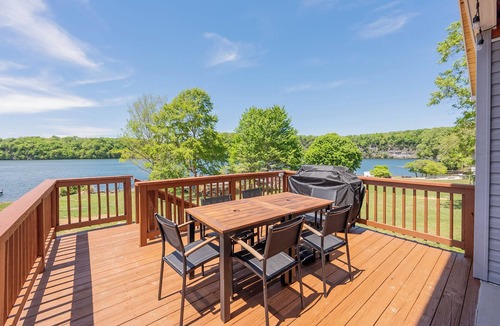 Ingles House | Lakefront Radford retreat with private dock, deck dining, Samsung Smart TV, and cozy queen bedrooms.