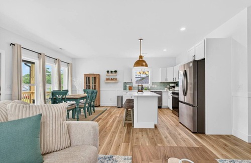 Tranquil Harbour House | Lux Oak Island Retreat | Walk to Beach | Private Suite + Fenced Yard!
