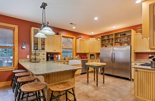 Bryson City Cabin | Luxury Creekside Lodge with Hot Tub & Game Room, Great for Large Groups!