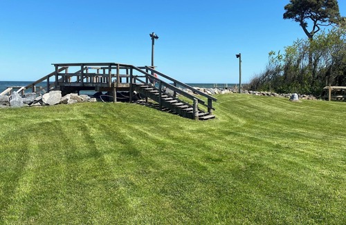 Gwynn House | New 5 bedroom home on private, sandy beach with game room and elevator.