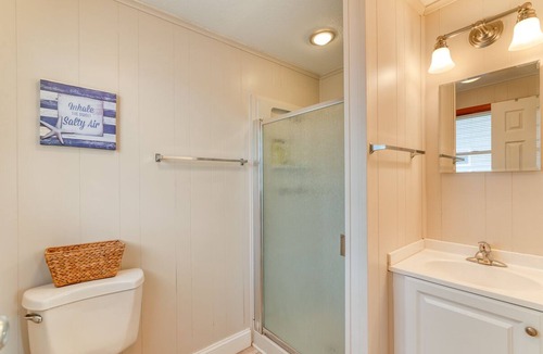 Ocean Isle Estates House | Oceanside cottage just a short walk to the beach with a community pool!