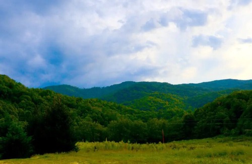Roan Mountain Cabin | OffGrid Glamping Yurt with mountain views on Doe River & Historic Tweetsie Trail