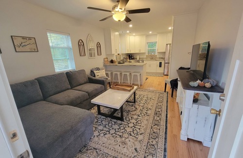Maryville House | Pristine creekside home in peaceful Maryville with sprawling yard and deck.