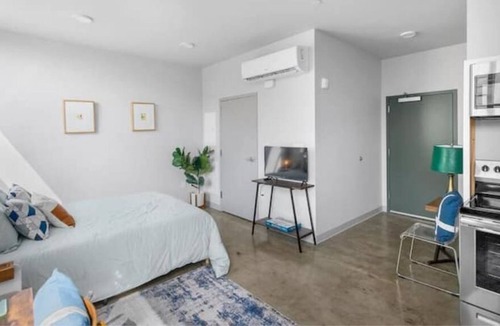 Central City Apartment | Private loft with rooftop deck, fitness center, and private parking.