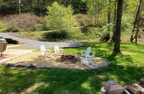 Upper Peachtree Cabin | Rustic two-story cabin on creek with covered bridge and water wheel.