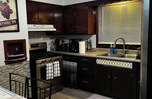 Campbell House | Spacious 3 level 4-bedroom house- 2 Full kitchens-2 king beds and 3 queen beds.