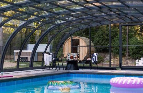 Candler House | Spacious 6 Bedroom Home with a Heated Salt Water Pool, Theater & Game Room