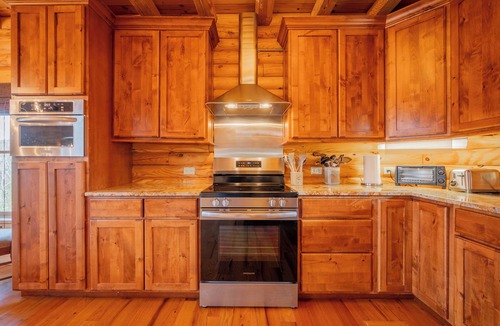 Allisonia House | Spacious log cabin with game room, large deck, and a quiet serene location for relaxed family getaways.