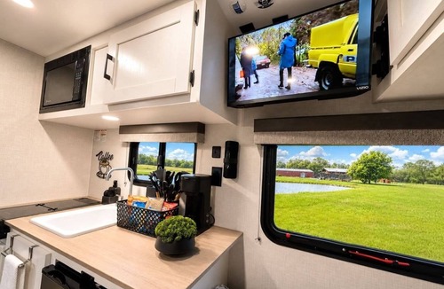 Winchester House | Stationary tiny camper in Winchester, TN with pond and mountain views.