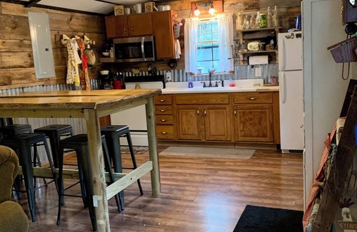 Cool Ridge Cabin | Step back in time with this unique cozy cabin by the creek.