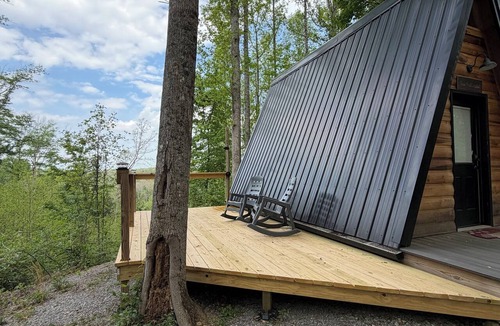 Corbin Cabin | The Naturalists is a peaceful off grid A frame cabin with an outdoor shower.