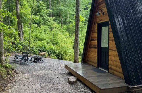Corbin Cabin | The Naturalists is a peaceful off grid A frame cabin with an outdoor shower.