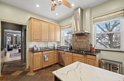 Rogers Park Apartment | This 2 bedroom 2 bathroom elegantly furnished home is ready for all your needs. Featuring a primary bedroom suite, TV room, dining room, and additional sitting areas.