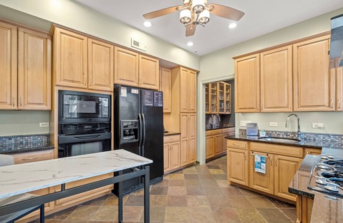 Rogers Park Apartment | This 2 bedroom 2 bathroom elegantly furnished home is ready for all your needs. Featuring a primary bedroom suite, TV room, dining room, and additional sitting areas.