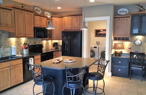 Salida Condo | This riverfront downtown condo boasts and open floor plan for kitchen, living room, and dining areas. Or step onto the balcony over the Arkansas River to hear the water rushing by. Oversized master suite has its own balcony and indoor sitting area.